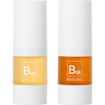 Biologi Bqk Radiance Face Serum Duo, two 15ml white cylindrical bottles with matching white caps and yellow and orange labels, standing side by side on white.