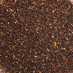 Close-up of finely textured brown and orange rosehip material, photographed as the botanical ingredient image for Biologi Br Rosehip Oil.