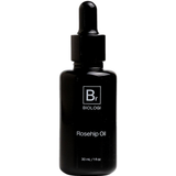 Biologi Br Rosehip Oil 30ml in an opaque black glass bottle with a black dropper cap and white Br lettering, shown upright on a plain white background.