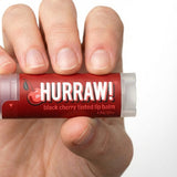 Hand holding Hurraw! Organic Lip Balm - Black Cherry 4.8g