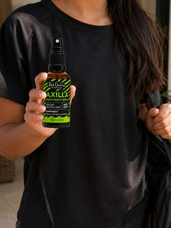 Black Chicken Remedies Axilla Rainforest Deodorant Spray — held in hand