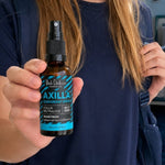 Black Chicken Remedies Axilla Wave Fresh Deodorant Spray — held in hand