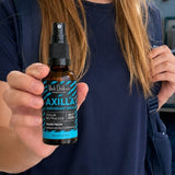 Black Chicken Remedies Axilla Wave Fresh Deodorant Spray — held in hand