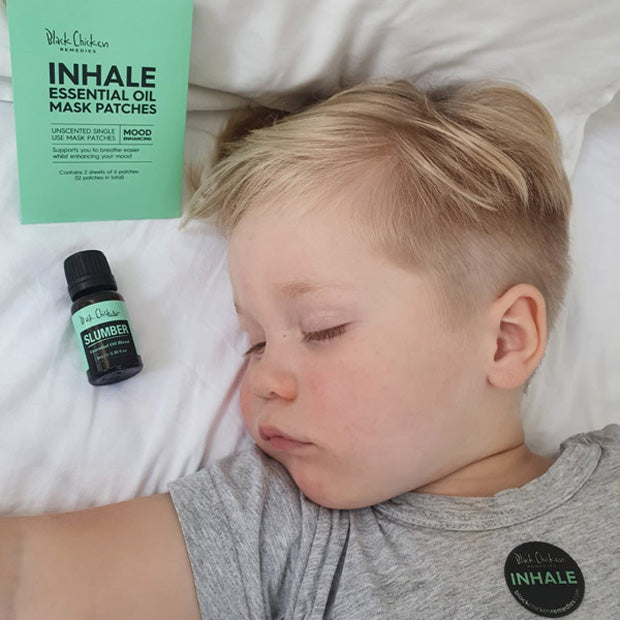 Child sleeping with a Black Chicken Inhale essential oil patch