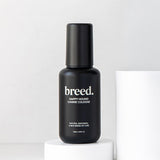 Black Breed Happy Hound Canine Cologne bottle displayed upright on a white studio plinth.