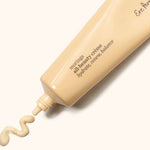 Ere Perez Moringa All-Beauty Creme tube with a swirl of cream on a soft cream background