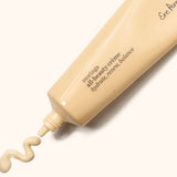 Ere Perez Moringa All-Beauty Creme tube with a swirl of cream on a soft cream background
