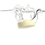 Ere Perez Ginkgo Micellar Cleanser tablet splashing into water on a white background