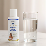 Cellfood Essential Silica Formula beside a glass of water