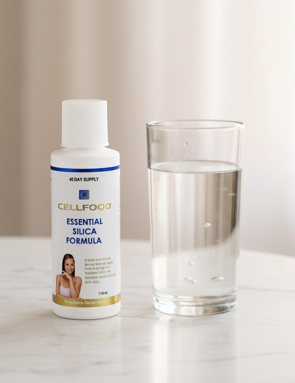 Cellfood Essential Silica Formula beside a glass of water