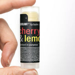 Hand holding Hurraw! Cherry & Lemon Lip Balm 4.8g