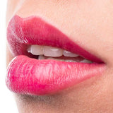 Close-up of glossy bright cherry lips wearing 100% Pure Cherry Lip & Cheek Stain.