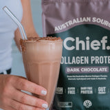 Hand holding a chocolate collagen drink beside CHIEF Collagen Protein