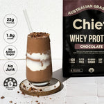 CHIEF Smooth Chocolate Whey Protein beside a chocolate shake