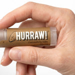 Hand holding Hurraw! Organic Lip Balm - Chocolate 4.8g