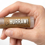 Hand holding Hurraw! Organic Lip Balm - Chocolate 4.8g