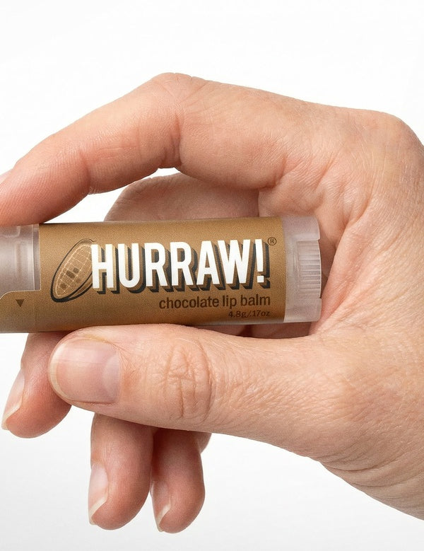 Hand holding Hurraw! Organic Lip Balm - Chocolate 4.8g