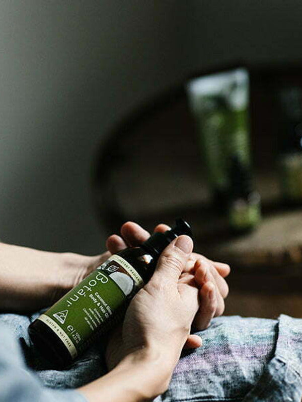 Botani Coconut Glow Body & Hair Oil 125ml — body and hair oil in hand