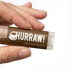 Hand holding Hurraw! Organic Lip Balm - Coffee 4.8g