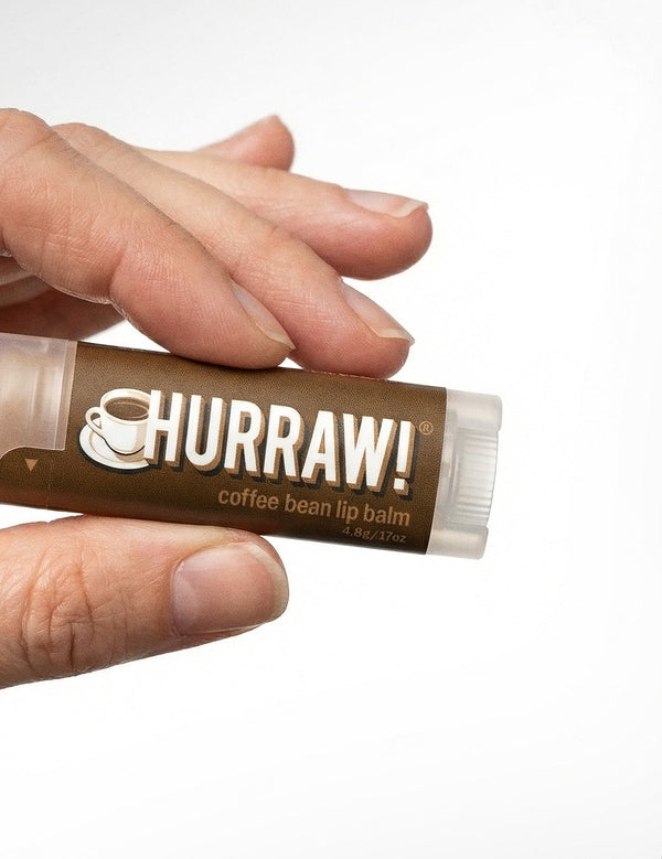 Hand holding Hurraw! Organic Lip Balm - Coffee 4.8g