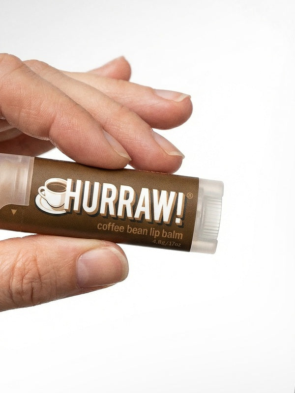 Hand holding Hurraw! Organic Lip Balm - Coffee 4.8g