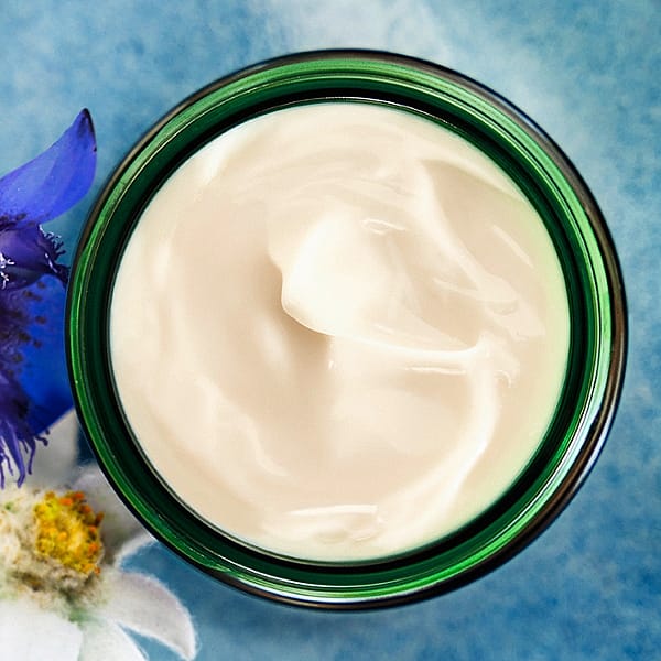 Contouring face cream jar open with cream product.