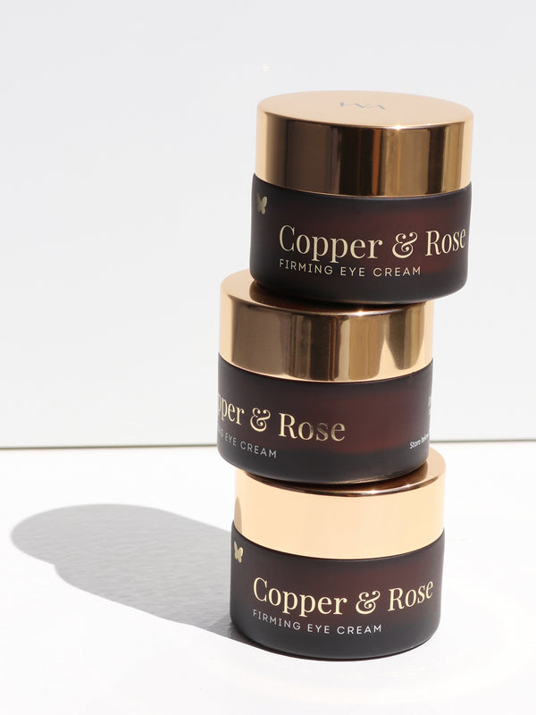 Stacked jars of Vanessa Megan Copper and Rose Firming Eye Cream
