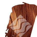 Close-up of reddish-brown hair representing Desert Shadow Caramel Shadow, cropped into an irregular brushstroke shape with the brand's pale geometric logo overlaid.