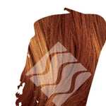 Reddish-brown hair swatch for Desert Shadow Chestnut Shadow, cropped into an irregular brushstroke shape with the brand's pale geometric logo overlaid.
