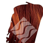 Close-up of deep copper-red hair with orange highlights for Desert Shadow Deep Red Shadow, cropped into a brushstroke shape with the brand's pale geometric logo overlaid.
