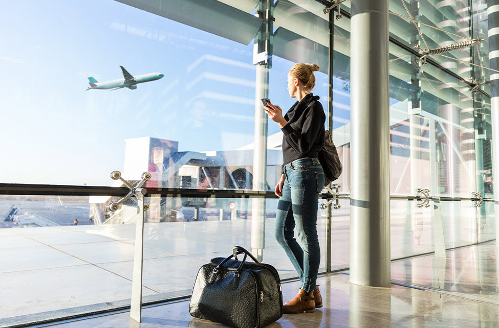 Traveller at an airport from the official doTERRA DigestZen Touch product page