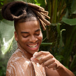Person washing with Dr. Bronner's Almond Magic Bar Soap