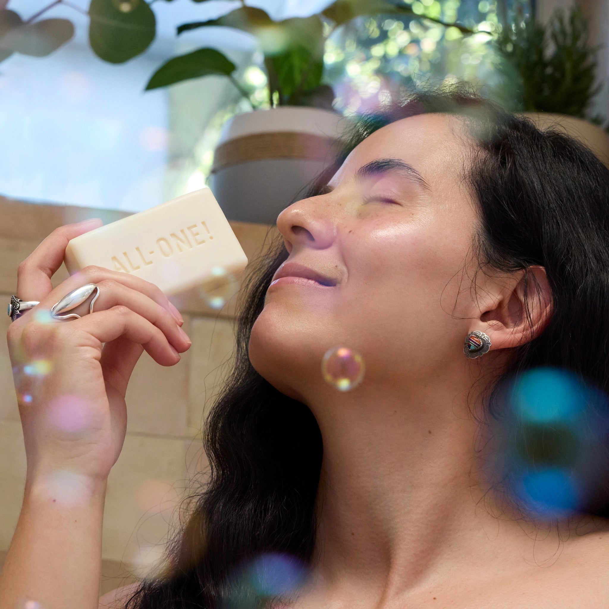 Person enjoying Dr. Bronner's Citrus Magic Bar Soap