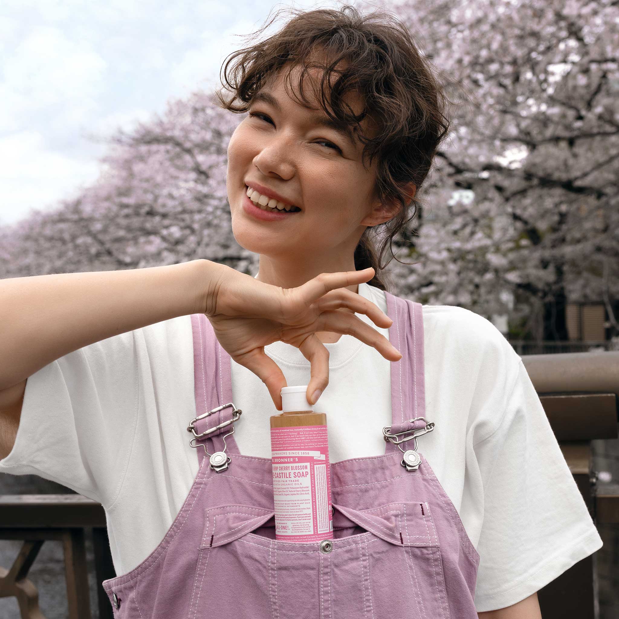 Person holding Dr. Bronner's Cherry Blossom Pure-Castile Liquid Soap