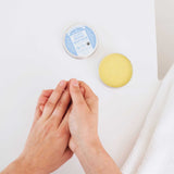 Person applying Dr. Bronner's Baby Unscented Organic Magic Balm