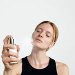 Model applying Dr. Hauschka Clarifying Toner