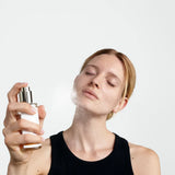 Model applying Dr. Hauschka Clarifying Toner