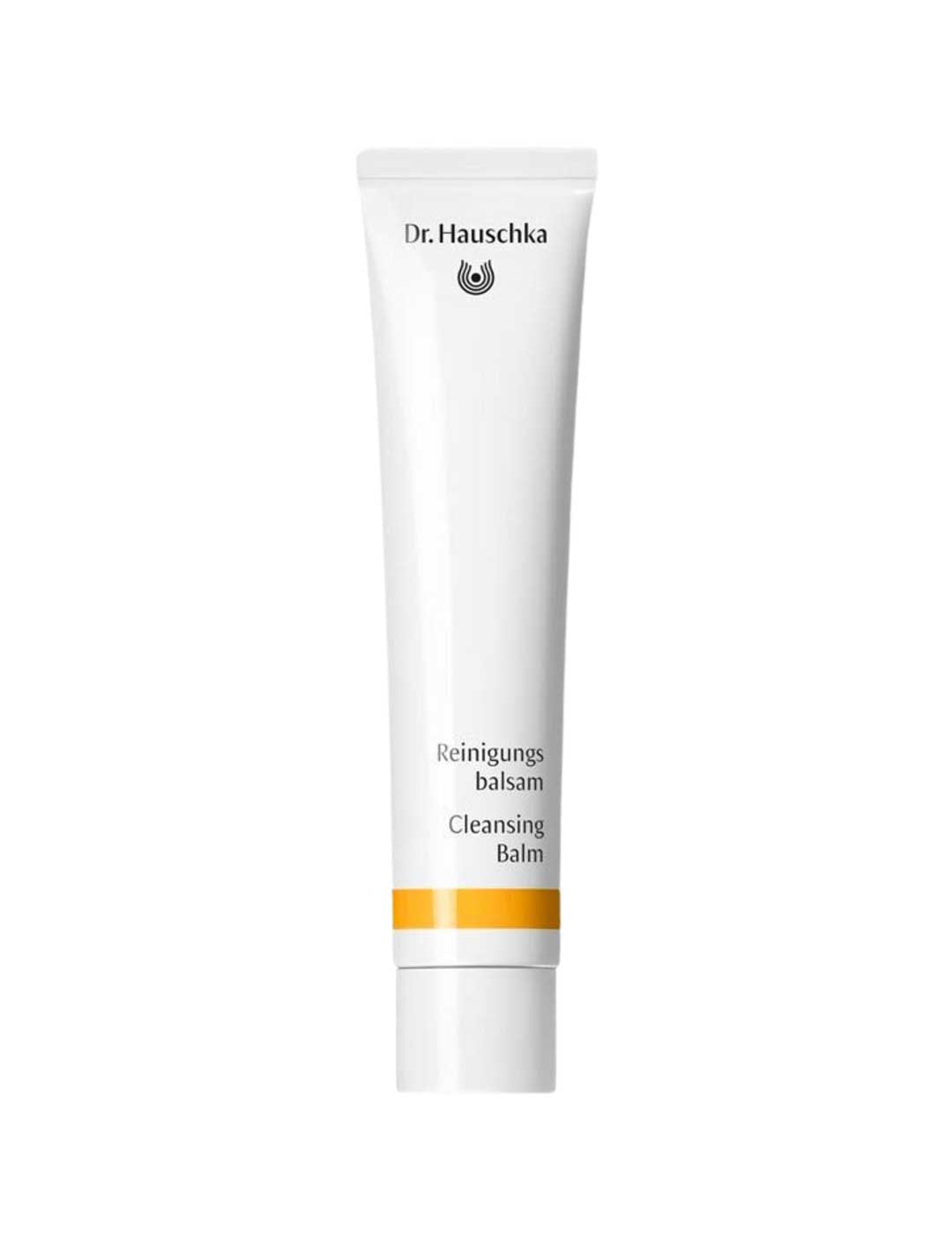 Dr Hauschka Cleansing Balm in a long white squeeze tube with a white cap, black lettering and a golden-yellow band near the base.
