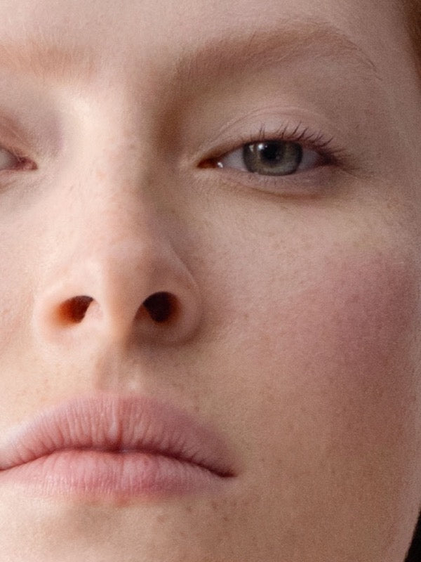 Close-up model wearing Dr Hauschka Concealer