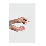 Hands holding Dr. Hauschka Daily Hydrating Eye Cream