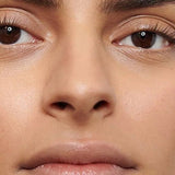 Close-up of a model's softly defined eyebrows showing the natural finish of Dr Hauschka Eyebrow Definer 1.05g.