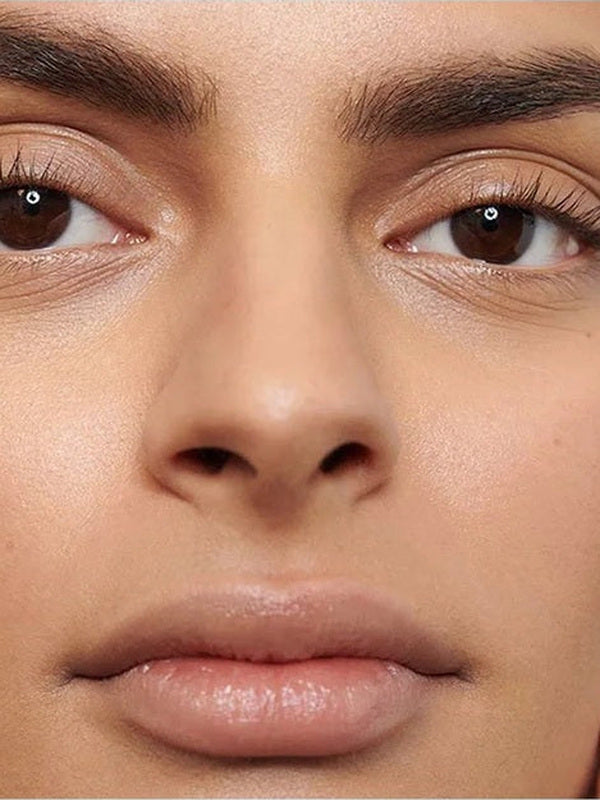 Close-up of a model's softly defined eyebrows showing the natural finish of Dr Hauschka Eyebrow Definer 1.05g.