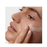 Model wearing Dr. Hauschka Illuminating Fluid