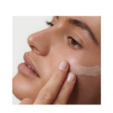 Model wearing Dr. Hauschka Illuminating Fluid