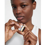 Model wearing Dr. Hauschka Lip Balm