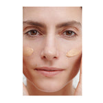 Model applying Dr. Hauschka Regenerating Day Cream Complexion