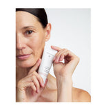 Model holding Dr. Hauschka Regenerating Day Cream