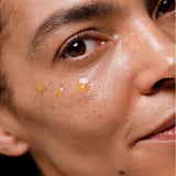 Close-up of Dr Hauschka Regenerating Eye Serum Intensive applied in small drops beneath a model's eye.