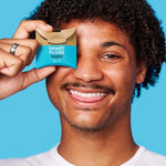 Person holding Dr Tung's Smart Floss Activated Charcoal