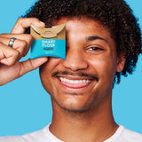 Person holding Dr Tung's Smart Floss Activated Charcoal